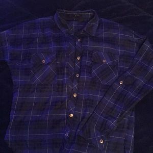 Long sleeved blue/black flannel shirt.